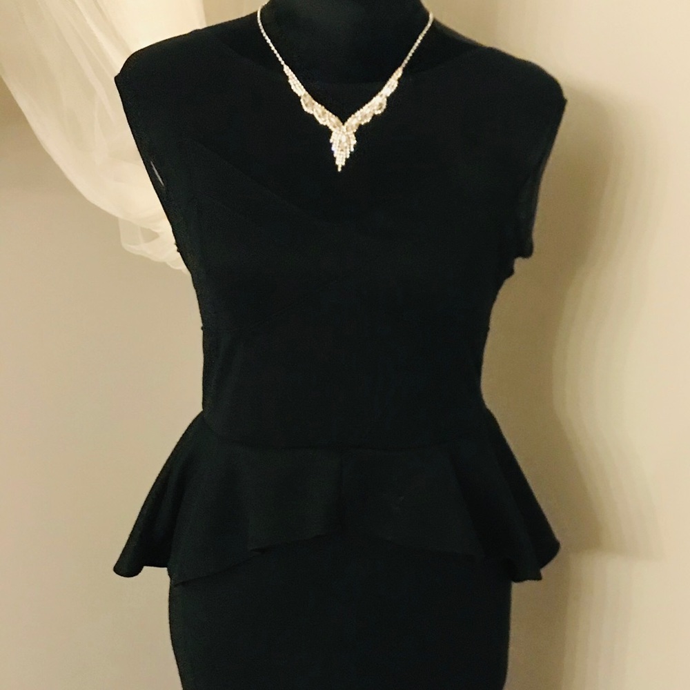 L Black cocktail dress with silver necklace